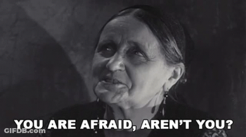 A Black And White Photo Of An Elderly Woman Saying You Are Afraid Aren 'T You GIF