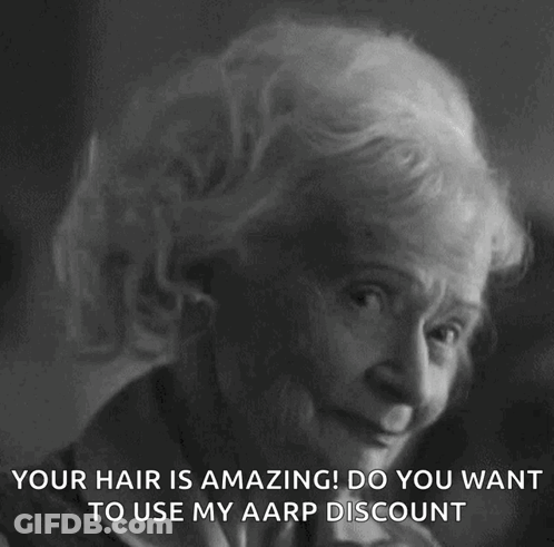 A Black And White Photo Of An Elderly Woman With The Caption " Your Hair Is Amazing ! Do You Want To Use My Aarp Discoun GIF