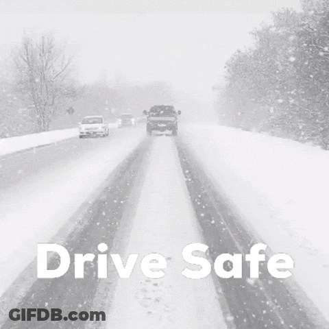 A Black And White Photo Of Cars Driving Down A Snowy Road GIF