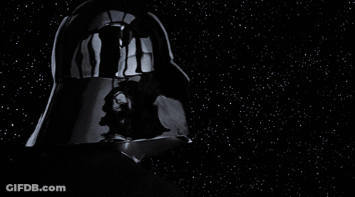 A Black And White Photo Of Darth Vader 'S Face GIF