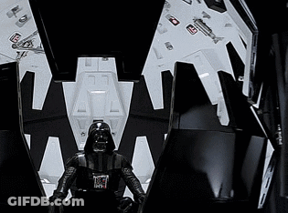 A Black And White Photo Of Darth Vader Sitting In A Throne GIF