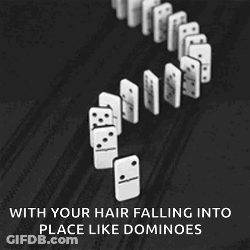 A Black And White Photo Of Dominoes Falling Into Place GIF