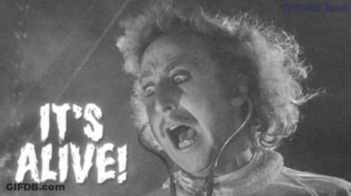 A Black And White Photo Of Frankenstein With The Words It 'S Alive On The Bottom GIF
