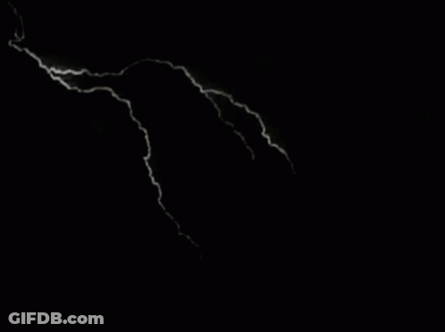 A Black And White Photo Of Lightning In The Sky GIF