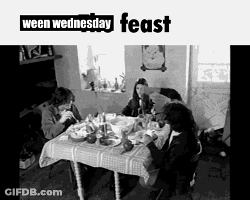 A Black And White Photo Of People Sitting At A Table With The Words Ween Wednesday Feast On The Bottom GIF
