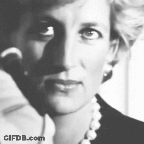 A Black And White Photo Of Princess Diana Wearing A Pearl Necklace . GIF