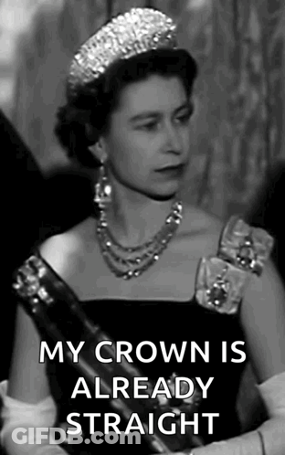 A Black And White Photo Of Queen Elizabeth Ii Wearing A Tiara And A Necklace . GIF