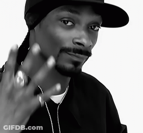 A Black And White Photo Of Snoop Dogg Wearing A Black Hat GIF