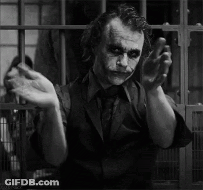 A Black And White Photo Of The Joker From The Movie The Dark Knight Rises . GIF