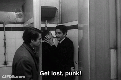 A Black And White Photo Of Three Men Standing In A Bathroom With The Caption Get Lost Punk GIF