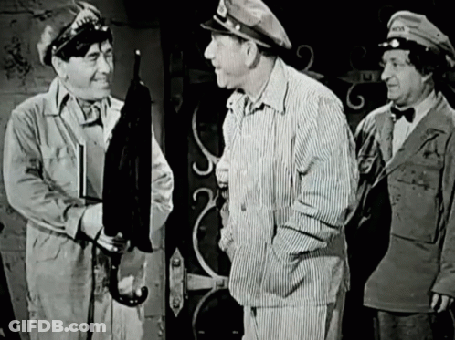 A Black And White Photo Of Three Men With One Wearing A Hat That Says " Army " GIF