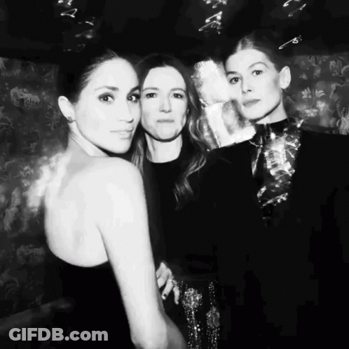 A Black And White Photo Of Three Women Posing For The Camera GIF