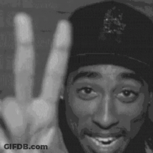 A Black And White Photo Of Tupac Shakur Making A Peace Sign . GIF