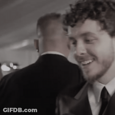 A Black And White Photo Of Two Men In Suits And Ties GIF