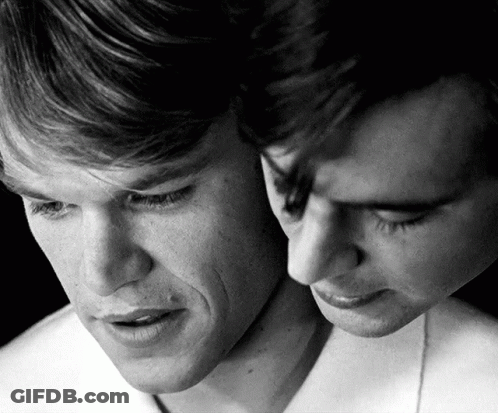A Black And White Photo Of Two Men 'S Faces With Their Eyes Closed GIF