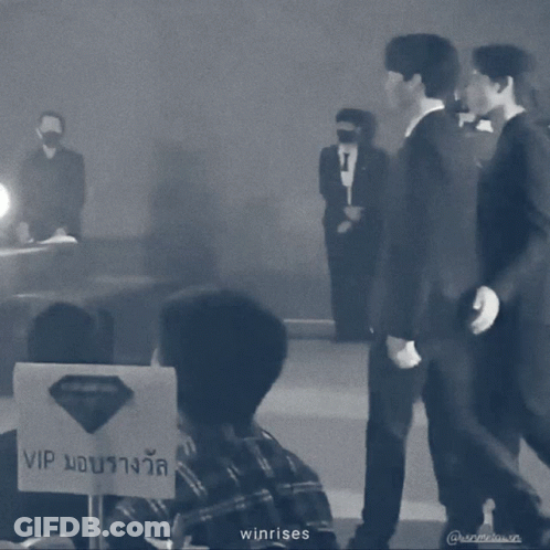 A Black And White Photo Of Two Men Standing Next To Each Other With The Words Winrises On The Bottom GIF