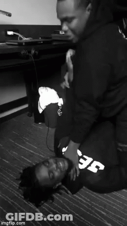 A Black And White Photo Of Two Men With One Wearing A Sweatshirt That Says Efc GIF