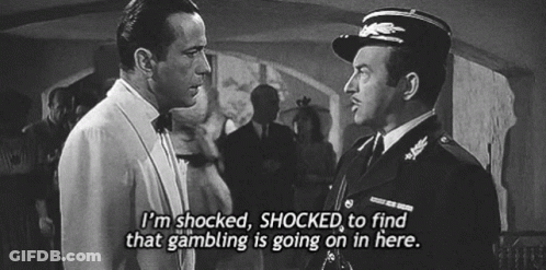 A Black And White Photo Of Two Men With The Caption I 'M Shocked Shocked To Find That Gambling Is Going On GIF