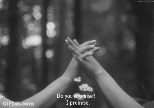 A Black And White Photo Of Two People Holding Hands With The Words Do You Promise - I Promise GIF