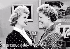A Black And White Photo Of Two Women Hugging Each Other And Saying I Love You . GIF