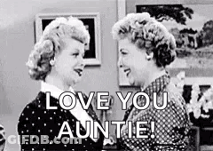 A Black And White Photo Of Two Women Standing Next To Each Other And Talking . GIF
