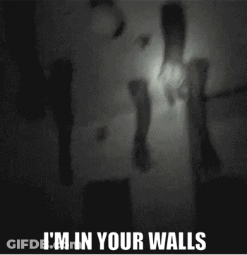 A Black And White Photo With The Words I 'M In Your Walls At The Bottom GIF