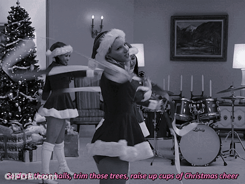 A Black And White Photo With The Words So Deck Those Halls Trim Those Trees Raise Up Cups Of Christmas Cheer At The Top GIF