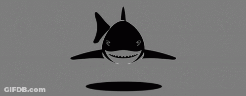 A Black And White Shark Is Smiling And Looking Out Of A Hole In The Water . GIF