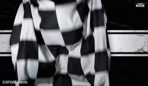 A Black And White Striped Shirt With A Motorsports Logo GIF