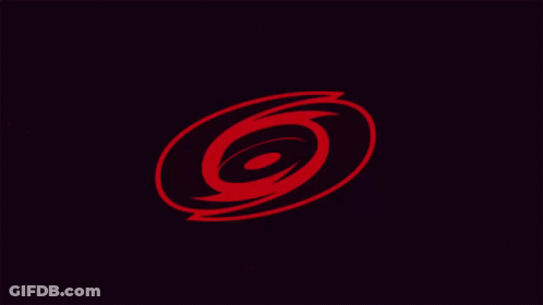 A Black And White Swirl With The Number 6 In The Center GIF