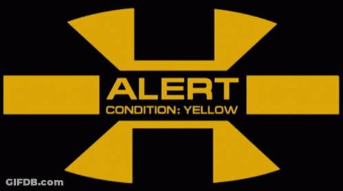 A Black And Yellow Sign That Says Alert Condition Yellow GIF
