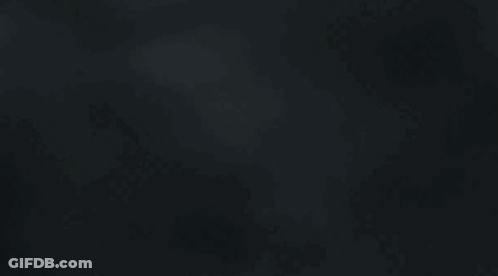 A Black Background With A Blurred Image Of A Cloudy Sky . GIF