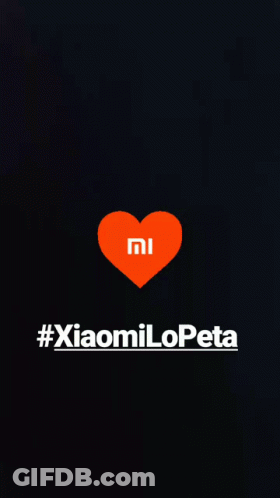A Black Background With An Orange Heart With The Mi Logo On It GIF