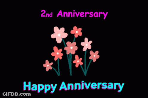 A Black Background With Pink Flowers And The Words Happy Anniversary GIF
