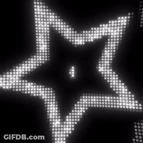 A Black Background With White Dots That Look Like A Star GIF