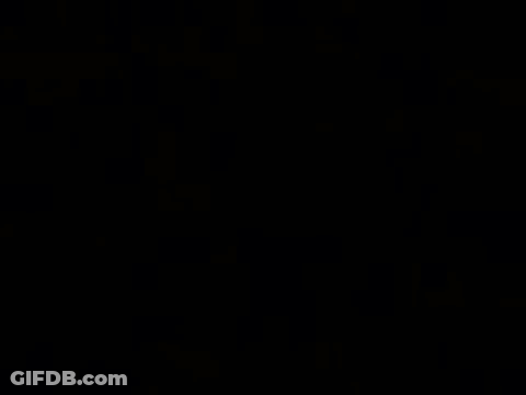 A Black Background With White Lines And A Cube In The Middle GIF