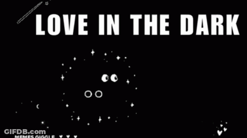 A Black Background With White Text That Says `` Love In The Dark '' . GIF
