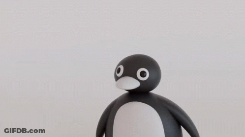 A Black Ball With White Eyes And A Red Nose GIF
