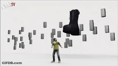 A Black Boot Is Surrounded By Blocks And The Words Nmjtv Are On The Bottom Right GIF