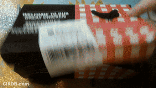 A Black Box With A Red And White Checkered Pattern Has The Word " Weapons " On It GIF