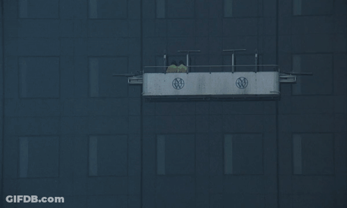 A Black Building With A White Sign On The Side That Says Ntv GIF