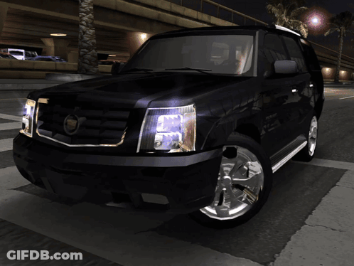 A Black Cadillac Suv Is Parked On A Street At Night GIF
