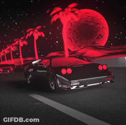 A Black Car Driving Down A Road With Palm Trees In The Background GIF