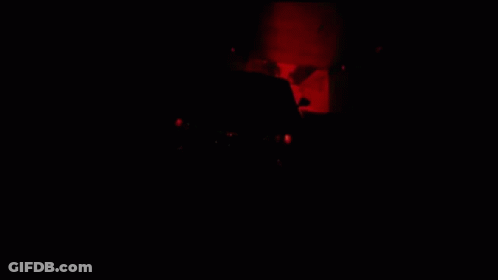 A Black Car Is Driving Down A Highway GIF