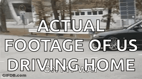 A Black Car Is Driving Down A Street With The Words " Actual Footage Of Us Driving Home " Above It GIF