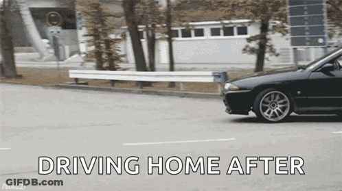 A Black Car Is Driving Down A Street With The Words Driving Home After GIF