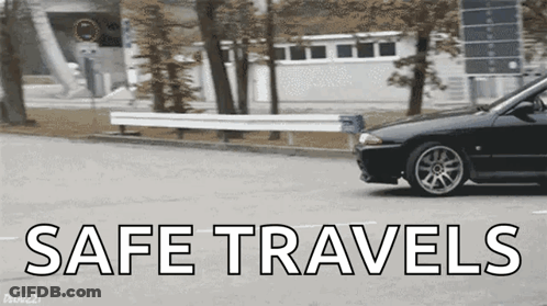 A Black Car Is Driving Down A Street With The Words Safe Travels Written On The Bottom GIF