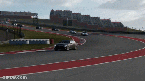 A Black Car Is Driving On A Race Track With A Delta Sign In The Background GIF