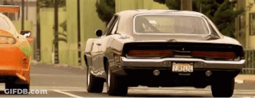 A Black Car With A California License Plate Is Parked Next To Another Car GIF