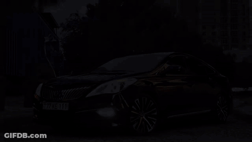 A Black Car With A License Plate That Reads 77 Ke 111 GIF